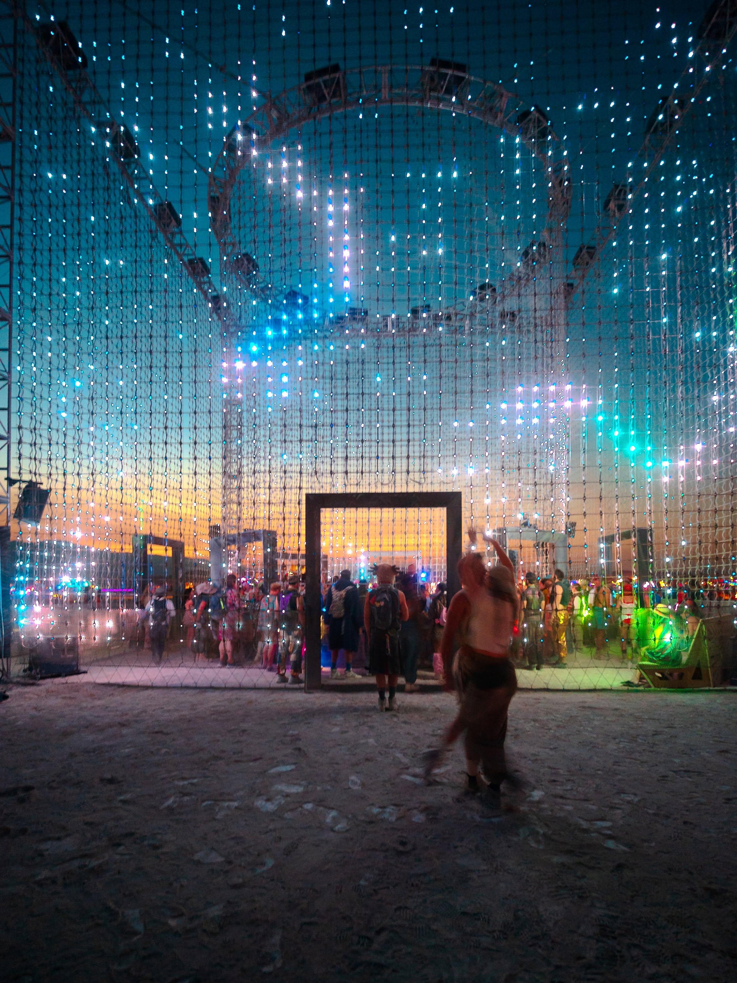 Inside Apotheneum's illuminated structure at Burning Man